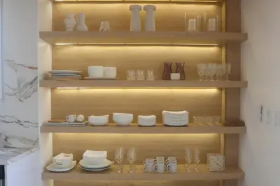 a shelf with plates and glasses and dishes on it at Villa Calula in Playa Hermosa