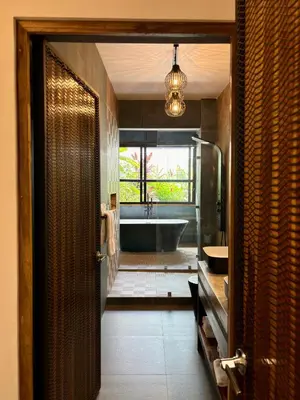 a bathroom with a bath tub and a sink at Desiree Luxury Apartamentos in Santa Teresa Beach