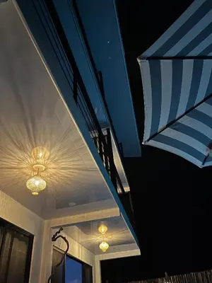 a house with a blue and white ceiling with lights at Cima Del Mar in Sámara