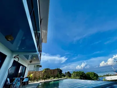 a swimming pool with a view of the ocean at Cima Del Mar in Sámara