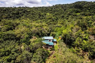 an aerial view of a house in the middle of a forest at Arenal Summit in Nuevo Arenal