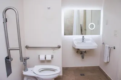 a bathroom with a toilet and a sink at Wyndham Tamarindo in Tamarindo