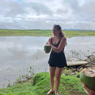 a woman standing next to a body of water at Mangrove boat tour lalo it is just a tour in Quepos