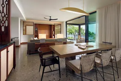 a living room with a dining table and a couch at Nekajui Peninsula Papagayo, a Ritz-Carlton Reserve in Papagayo, Guanacaste