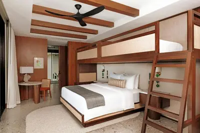 a bedroom with a bunk bed with a ceiling fan at Nekajui Peninsula Papagayo, a Ritz-Carlton Reserve in Papagayo, Guanacaste