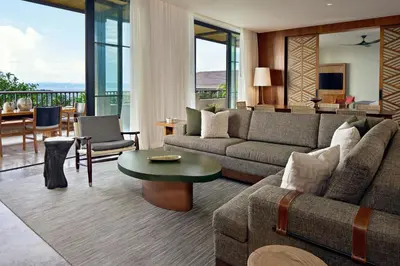 a living room with a couch and a table at Nekajui Peninsula Papagayo, a Ritz-Carlton Reserve in Papagayo, Guanacaste