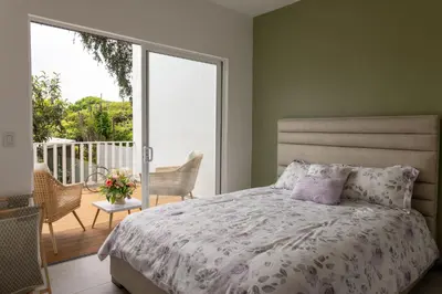 a bedroom with a bed and a balcony at Stylish Oasis Retreat with Modern Amenities & Scenic Views in San Rafael