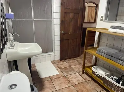 a bathroom with a sink and a toilet at Sea view Apartment in Puerto Limón