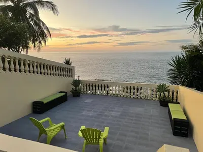 a patio with a view of the ocean at Ocean view Apartment in Puerto Limón