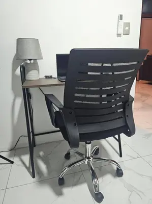 a black office chair sitting in front of a desk at Casa Tigrillo - La Fortuna in Agua Azul
