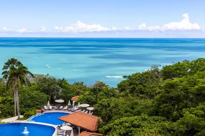 a view of the ocean from a resort at Vista Suites at Parador - Adults Only in Manuel Antonio