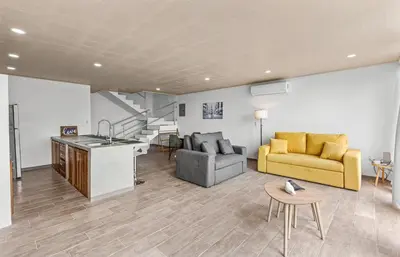 a living room with a couch and a table at Casa amor del sol apartment # 2 in Quebrada Ganado