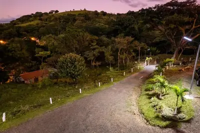 a dirt road with a hill in the background at Hospedaje Rancho mi Tata in Solania