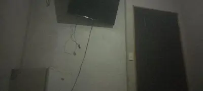 a room with a television on the wall of a room at Puertohumo in Puerto Humo