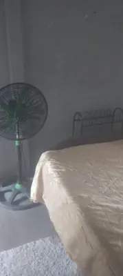a bedroom with a bed and a lamp next to it at Puertohumo in Puerto Humo