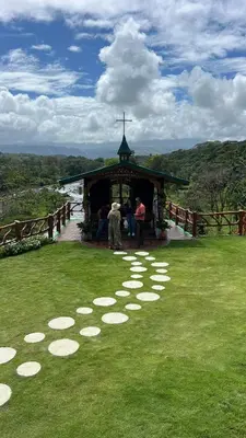 a group of people standing outside of a gazebo at Villa Girasol in Sarapiquí