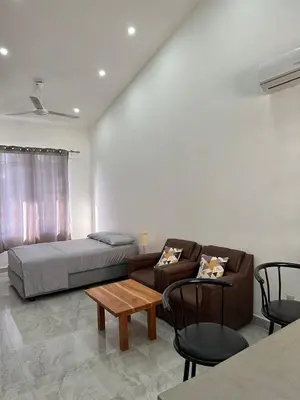 a living room with a bed and a couch at Hotel Bella Tamarindo Guanacaste in Tamarindo