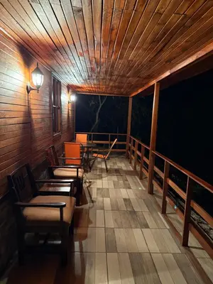 a room with chairs and tables and a wooden ceiling at Colonial Guanacaste Villas in Guanacaste