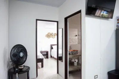 a mirror in a room with a bedroom at Casa DesKanso - La Fortuna in Fortuna