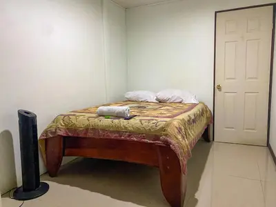 a small bed in a room with two pillows on it at Hospedaje Shaddai in Palo