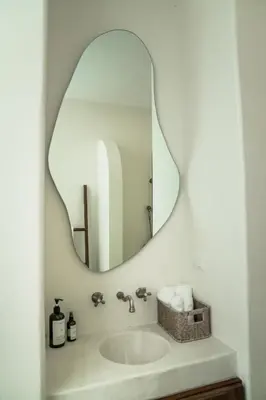 a bathroom with a sink and a mirror at The Beach Break Surf Hotel in Nosara