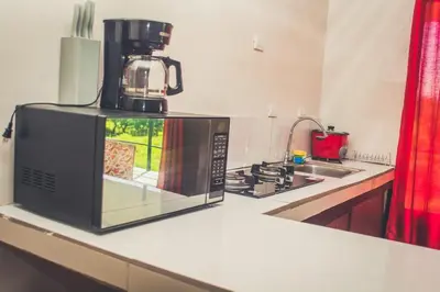 a microwave sitting on top of a kitchen counter at Villas Antomar in Puntarenas