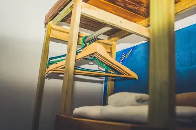 a wooden shelf with a hanger on it at Villas Antomar in Puntarenas