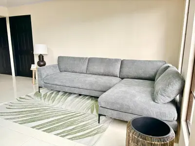a living room with a couch and a table at Arenal by the river in San Francisco