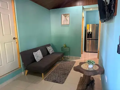 a living room with a couch and a table at Casas DiTi in Santa Cruz