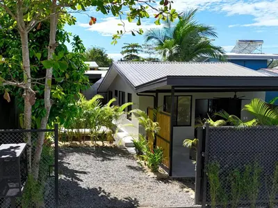 a small house with a fence in front of it at Private Tail House centre Uvita in Uvita
