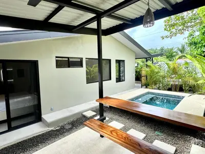 a pool in the backyard of a house at Private Tail House centre Uvita in Uvita