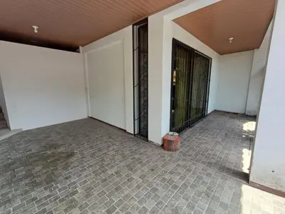 an empty room with white walls and a door at Sol De Fati in Quepos