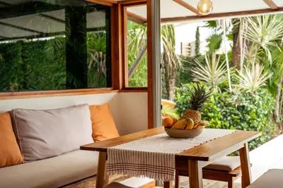 a table with a bowl of fruit on top of it at Casa Bismarkia in Santa Teresa Beach