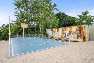 a tennis court with a mural on the side of a building at Blue Ridge Retreat in Potrero