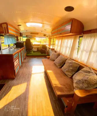 a living room with a couch in a rv at Bus Glamping near La Fortuna with Private Jacuzzi & Breakfast in Santa Clara