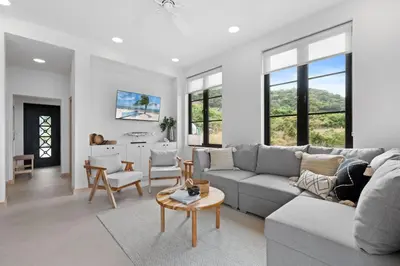 a living room with a couch and a table at Sophisticated Modern Home with Ocean Views, Gorgeous Master Suites & Private Jacuzzi in Playa Danta