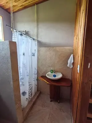 a bathroom with a sink and a shower at Casa Elora in Bagaces