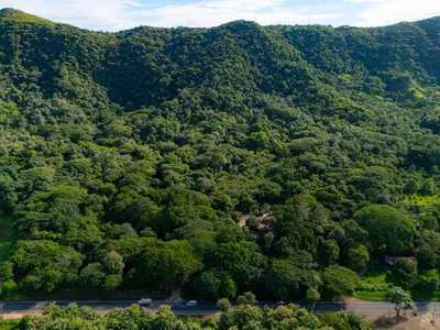 an aerial view of a lush green mountain at Cabinas La Fulanita in Nicoya