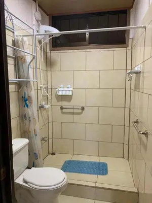 a bathroom with a shower with a toilet and a sink at Casa el Silencio in Arbolito