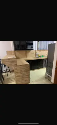 a kitchen with a table and a counter top at Casa el Silencio in Arbolito