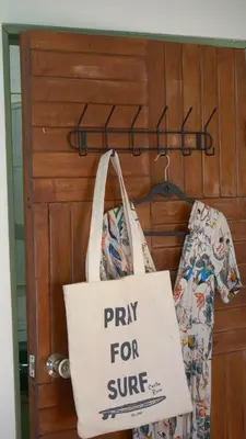 a pray for cure bag hanging on a door at Casa Oh - Oceanview Guesthouse in Uvita