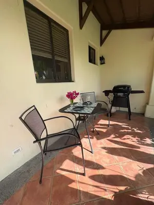 a patio with two chairs and a table with a laptop at Coco Sunset Hills #42 in Coco