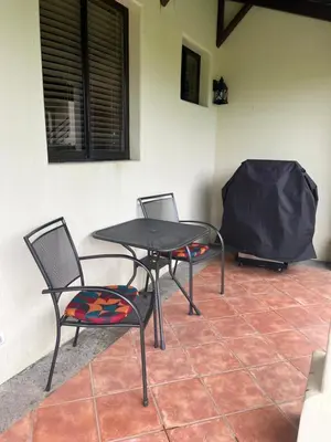 two chairs and a table in a room at Coco Sunset Hills #42 in Coco