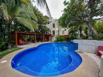 a swimming pool in front of a house at Coco Sunset Hills #42 in Coco