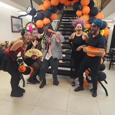 a group of people dressed up for a halloween party at Brisas del Aeropuerto Airport Breezes inn in Heredia