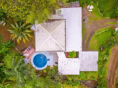an overhead view of a building with a swimming pool at La Maison de Vénus in Tortugal