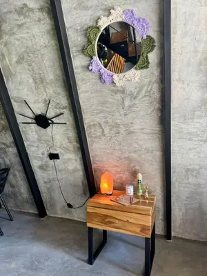 a mirror on a wall with a table with a lamp at Chalet de los ciervos in Isla Cabuya