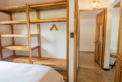a bedroom with a bunk bed and a closet at Casa Swell Boutique Hotel Santa Teresa in Santa Teresa Beach