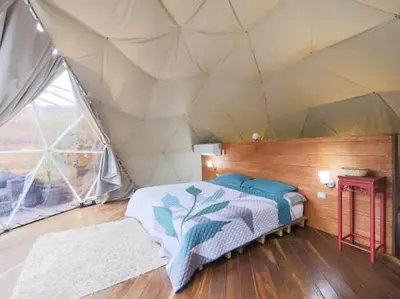 a room with a bed in a tent at Moonlight glamping in Fortuna