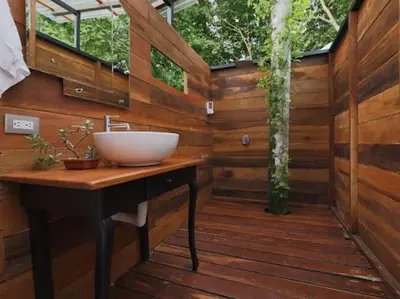 a bathroom with a sink on a wooden deck at Moonlight glamping in Fortuna